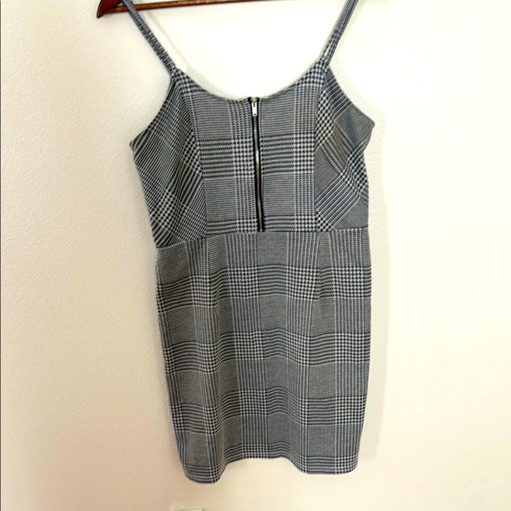 Cute black and black and white houndstooth pinafore with zip down chest